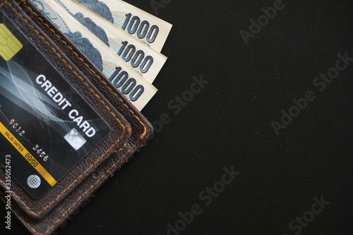 Wallpaper Mural Japan currency paper banknote and coins on dark background, banking economic and finance concept, Japanese money investment ,profit and savings Torontodigital.ca