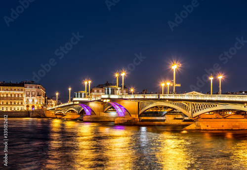 Night view of Blagoveshchensky drawbridge with an evening of multi-colored changing illumination. Saint Petersburg  Russia