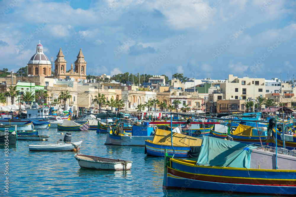 Marsaxlokk / Malta 09/30/2015.Panoramic view of the Marsaxlokk port, with Luzzus typical boats of the Island of Malta