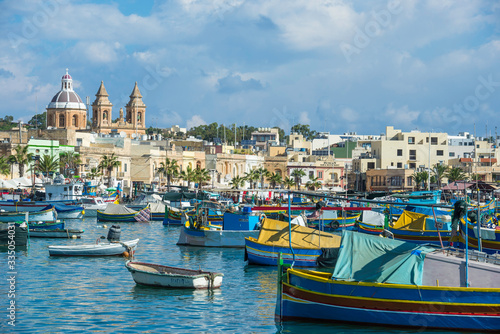 Marsaxlokk / Malta 09/30/2015.Panoramic view of the Marsaxlokk port, with Luzzus typical boats of the Island of Malta