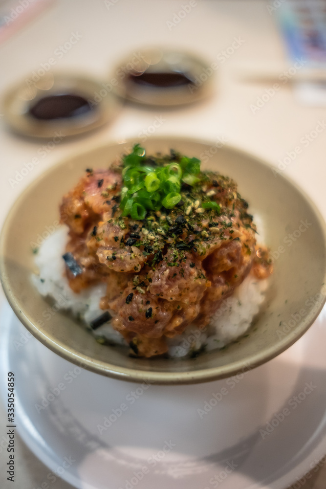 Close up of Spicy Salmon Rice Bowl - furikake over rice Close up of Spicy Salmon Rice Bowl - furikake over rice