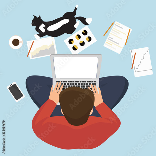 Man working at home and using laptop. People staying home to be protect from coronavirus. Lockdown quarantine. Top view of man with laptop.