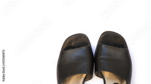 black female shoes on a white background. Flat lay, top view of fashionable beauty female background.