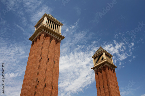 View of of iconic pair of towers (Torres Venecianes) built in the 1920s in Barcelona. It is a sunny summer day. photo
