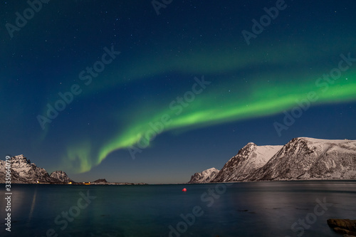 The polar arctic Northern lights hunting aurora borealis sky star in Norway travel photographer mountains. long shutter speed.