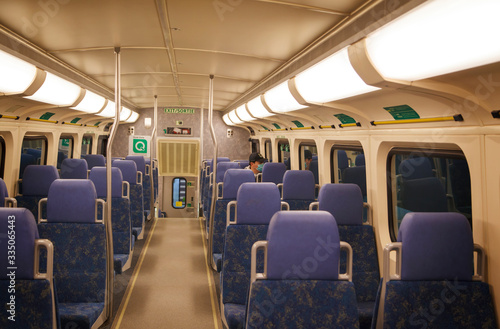 Coronavirus, covid 2019, Man with respiratory mask traveling in the public transport by train.