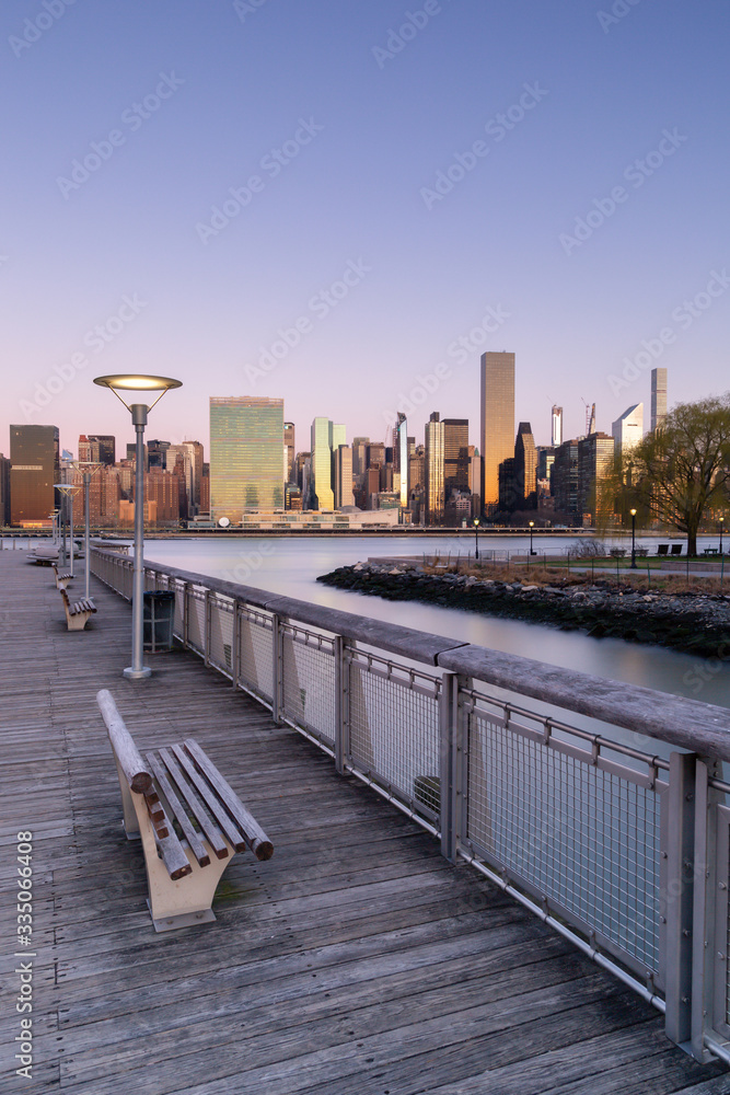 View on Midtown Manhattan From Long Island pier during sunrise with long exposure