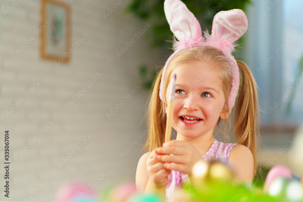 Portrait of a cute toddler girl with bunny ears