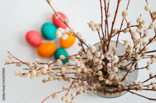 spring still life with a bouquet of willow with colored Easter eggs