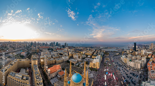 Beirut, Lebanon, 22 November 2019 : sunset drone panorama shot in Martyr square, on Lebanon independence day, during the Lebanese revolution, with thousands of people revolting against government