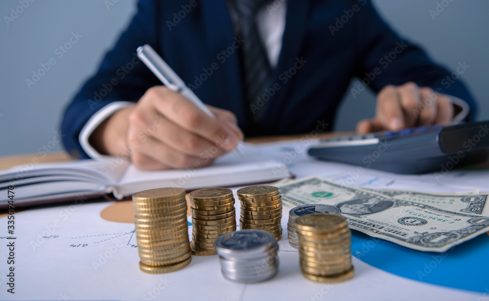 Fototapeta premium businessman considers company profit in office