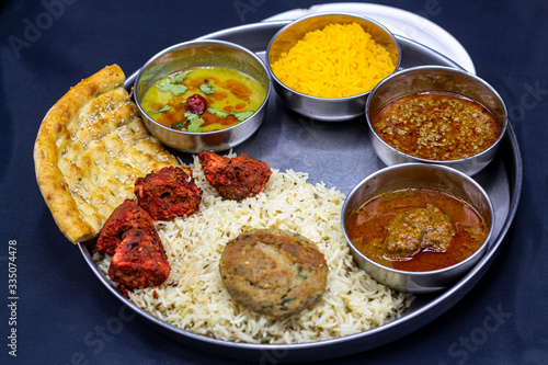 Rice with chicken tikka cutlet and salad salan with sweet