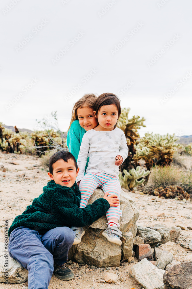 Siblings Exploring Desert Landscape Siblings Exploring Desert Landscape