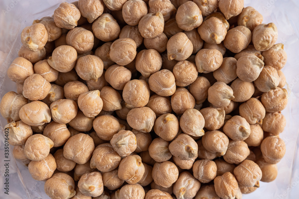 a lot of dried chickpeas for making hummus on a white background a lot of dried chickpeas for making hummus on a white background