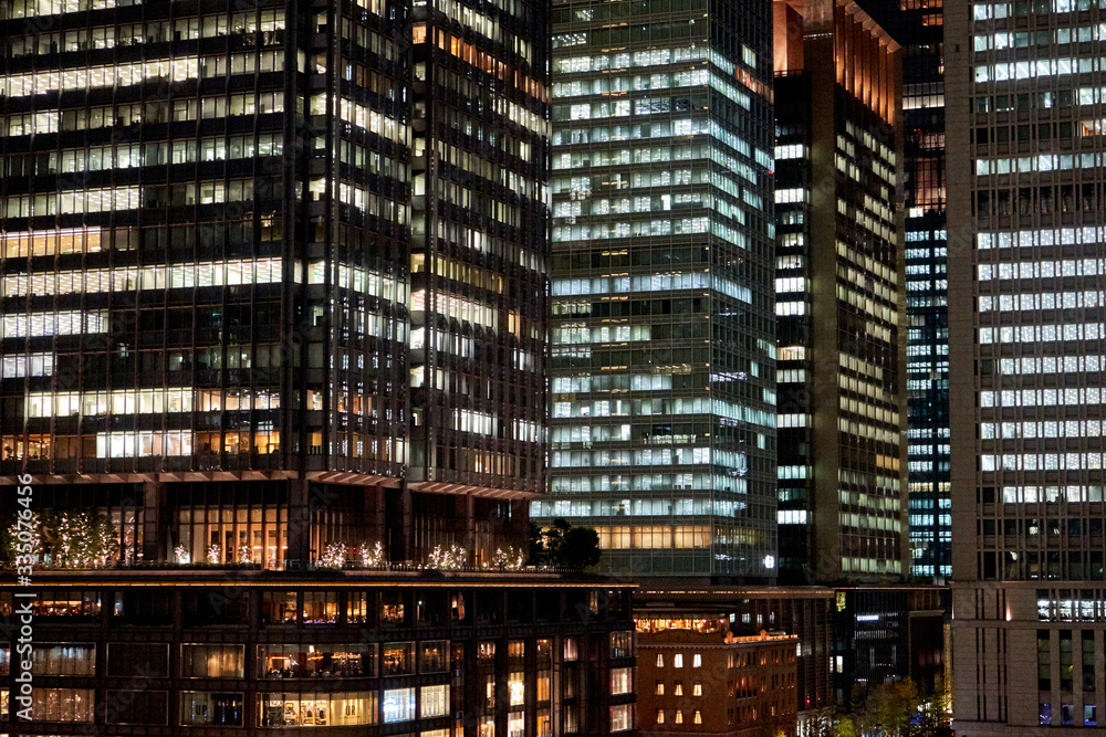 Obraz premium Modern Tokyo skyscrapers with many lights at night