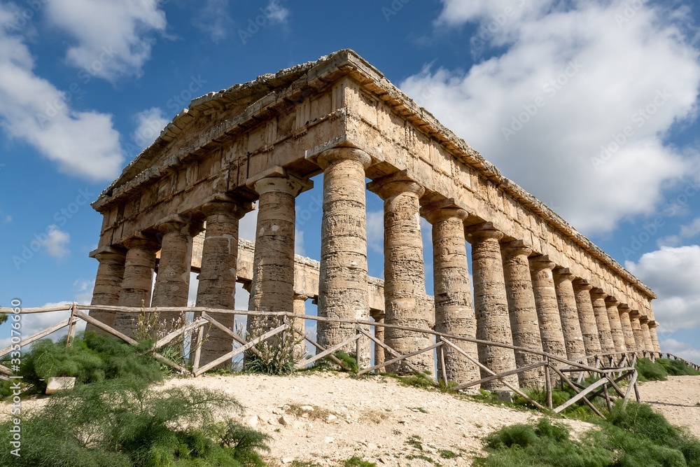 Ancient Doric temple of Segesta which is under reconstruction in sunny spring day and strong perspective view