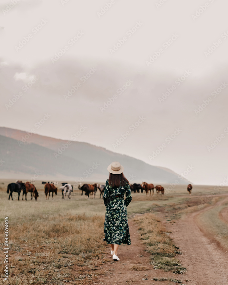 girl walking on field