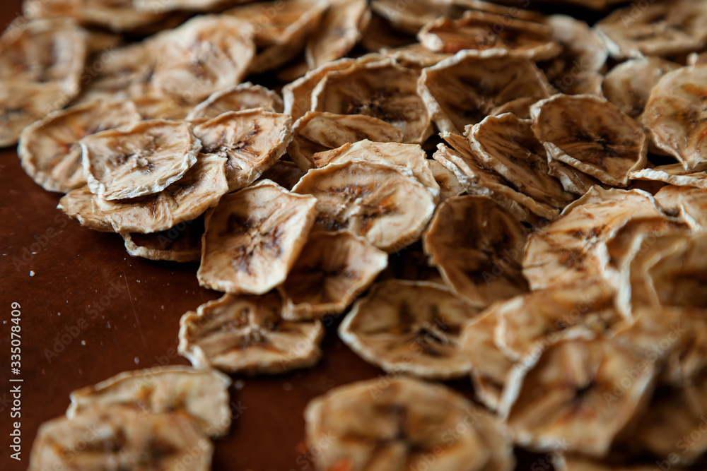 Homemade Dehydrated Banana Chips. dehydrated slices of bananas. healthy food. healthy snack