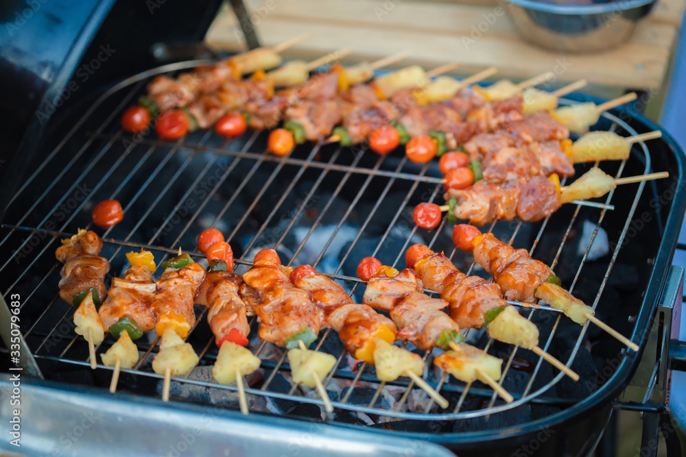 Grill the barbecue on a large stove for a party during the holidays.