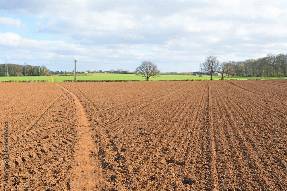 A pathway through ploughed and tilled farmland, in the Covid 19 era, April 2020.