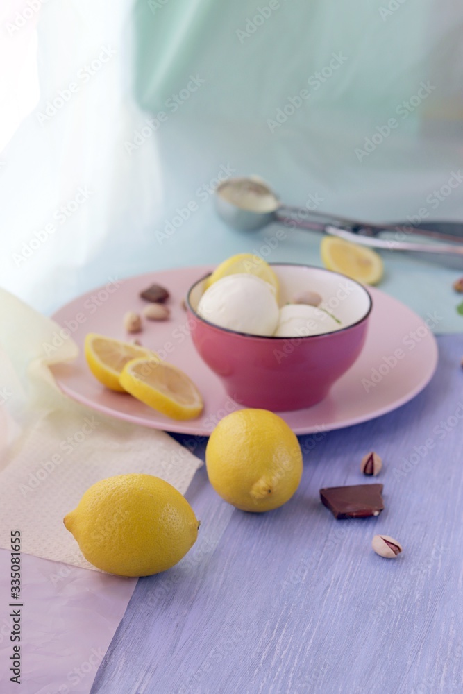 Natural ice cream, lemons on a wooden table, homemade dessert, healthy food Natural ice cream, lemons on a wooden table, homemade dessert, healthy food