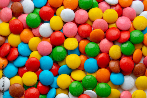 Background of small multicolored dragees. sweet color candy