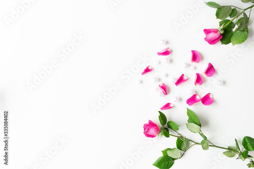 Wallpaper Mural Pink, white, green flat lay: Pearls, pink rose petals, on white bright background. Beautiful set up. Top view, copy space, mock up.  Torontodigital.ca