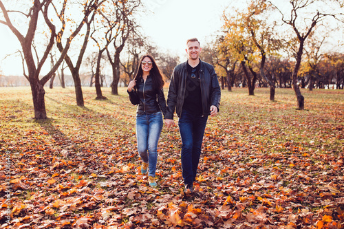 Happy young couple holding hands together walking confidently forward in life © andrey gonchar