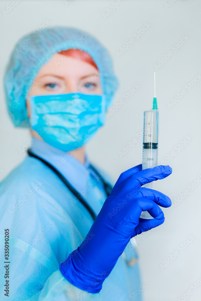 a medic holds a shot in his hands a medic holds a shot in his hands