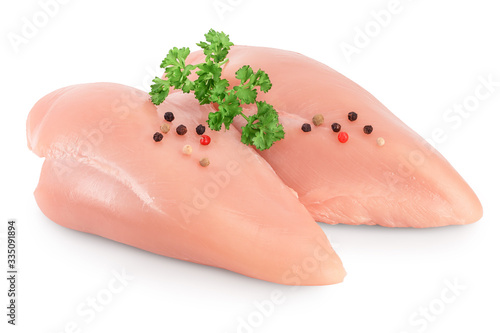 Photo Fresh chicken fillet with parsley isolated on white background with clipping path and full depth of field