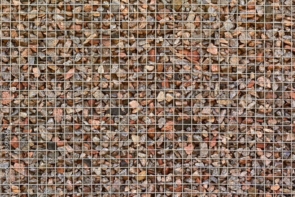 Fototapeta premium Stone filled metal mesh fence
