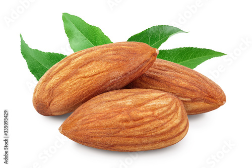 Almonds nuts with leaf isolated on white background with clipping path and full depth of field.