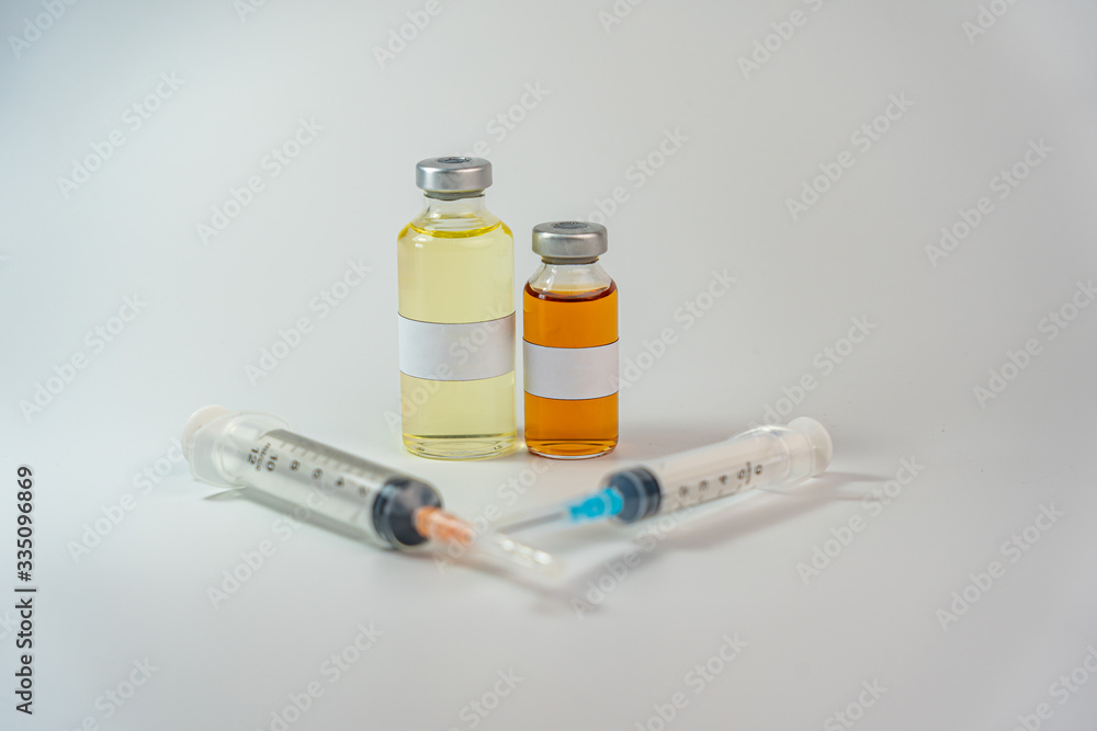 Two vaccine bottle with blank label and syringe injection Two vaccine bottle with blank label and syringe injection