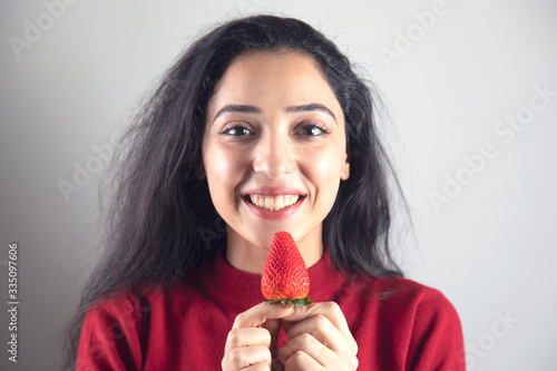 happy woman eat strawberries