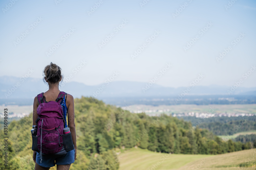 View from behind of a female hiker