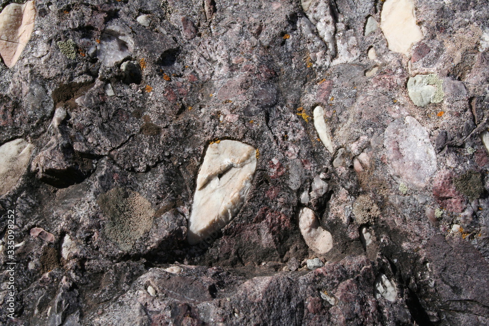 Embedded rock in older shell Embedded rock in older shell