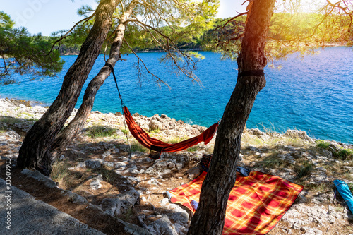 Fototapeta Naklejka Na Ścianę i Meble -  hanging hammock in Cikat forest park beach Mali Losinj