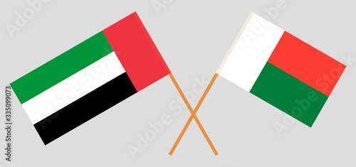 Crossed flags of Madagascar and the United Arab Emirates