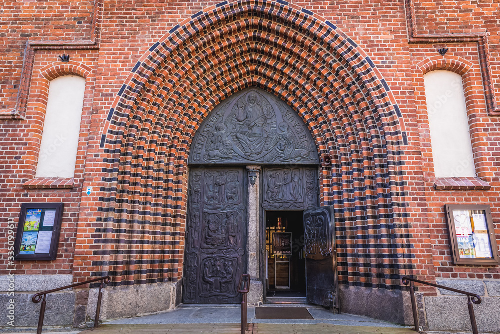 Entry to Assumption of Blessed Virgin Mary Basilica in Kolobrzeg coastal city over Baltic Sea, Poland