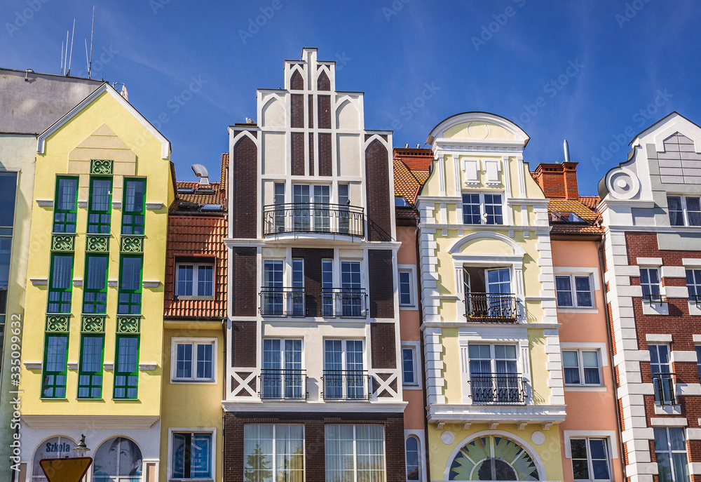 Row of townhouses in the old town of Kolobrzeg coastal city over Baltic Sea, Poland