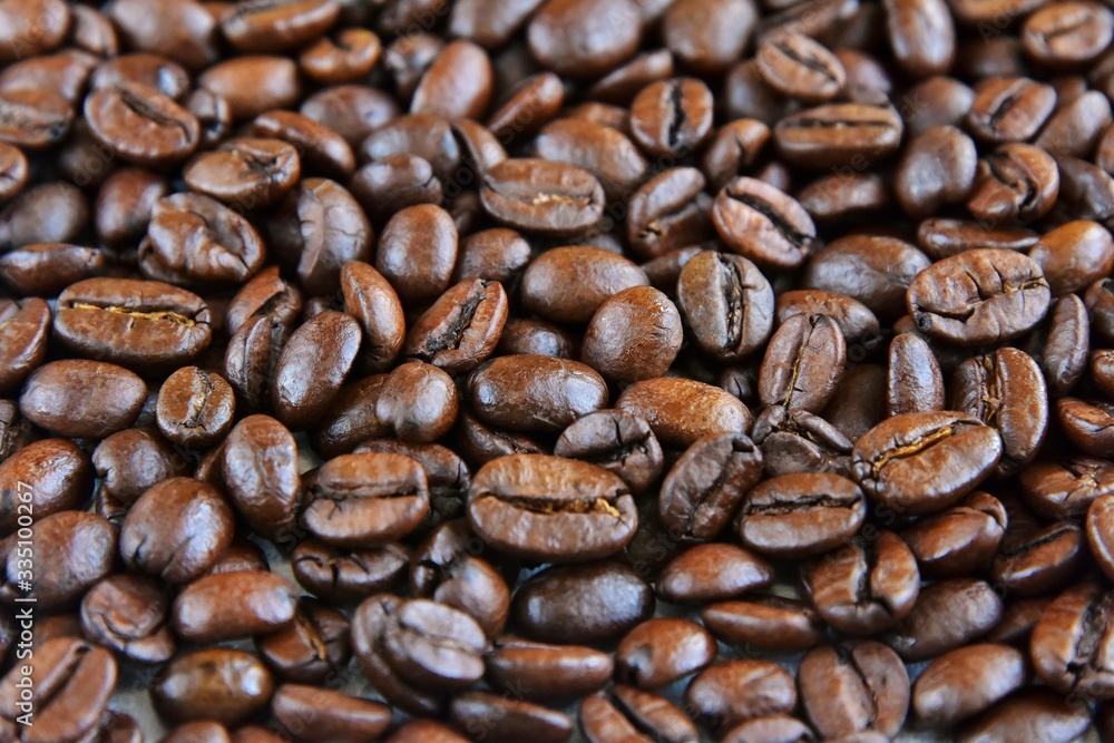 Roasted Coffee beans background with selective focus. Arabica coffee seeds.
Roasted Coffee beans background with selective focus. Arabica coffee seeds.