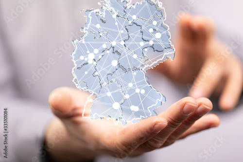 a virtual germany land map digital in hand 3d