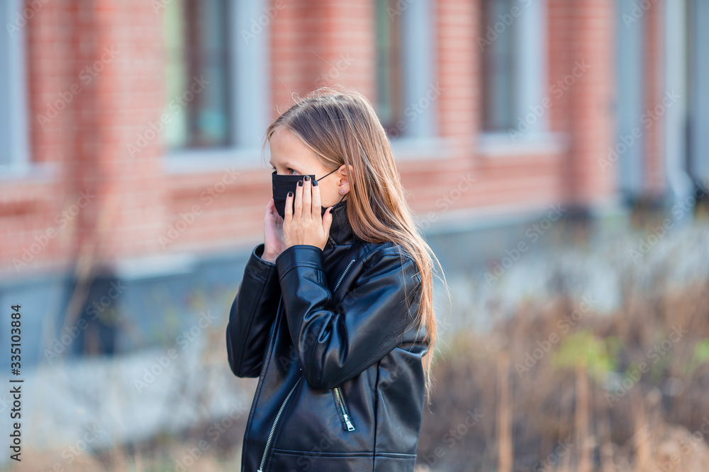 Girl wearing a mask on a background of a modern building, Girl wearing a mask on a background of a modern building,