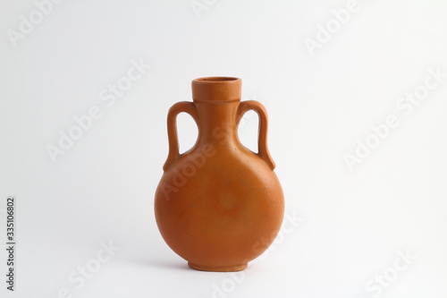 clay brown jug isolated on a white background. vintage empty jug front view. vintage capacity