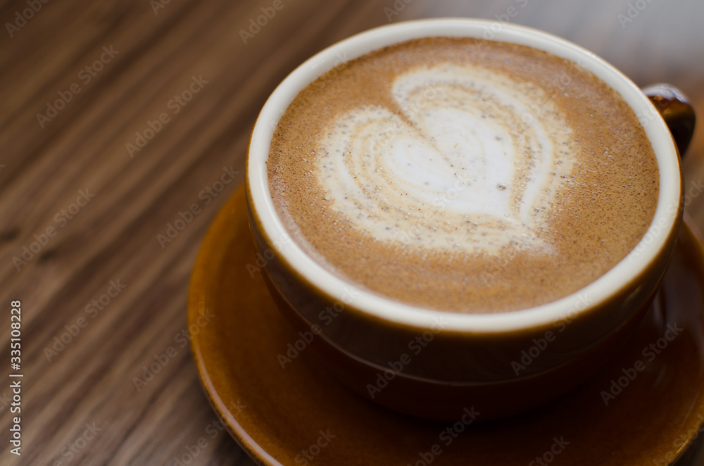 cup of coffee on wooden table cup of coffee on wooden table