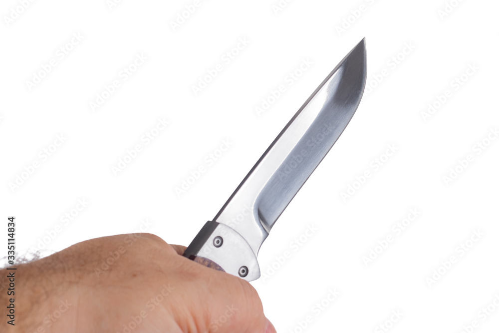 hunting knife in a hand isolated on white background hunting knife in a hand isolated on white background