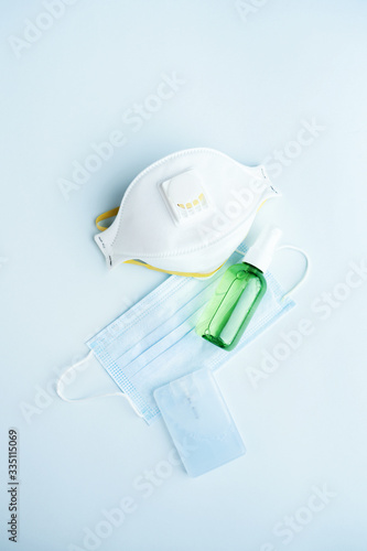 Antivirus set of items: various filtering safety face masks, sanitizer for hands.