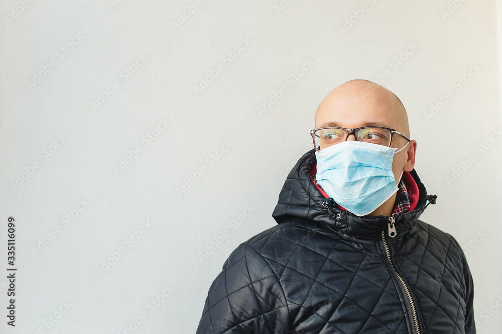 Portrait of young man in medical mask Portrait of young man in medical mask