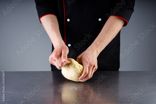 cooking dough sprinkling flour in a restaurant kitchen1