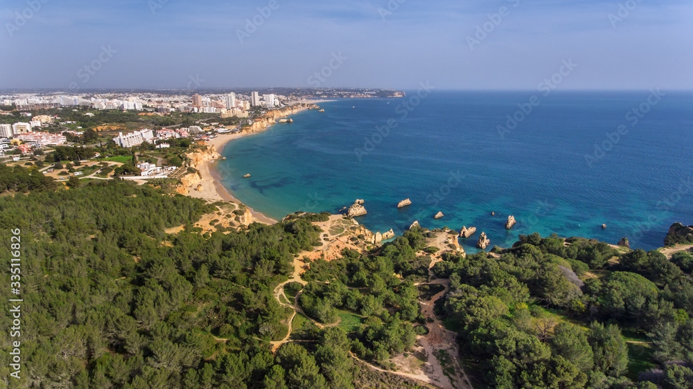 Aerial view of the beautiful bay of the Portuguese coast of the city of Portimao. Beaches Vao, Tres Irmaos. Aerial view of the beautiful bay of the Portuguese coast of the city of Portimao. Beaches Vao, Tres Irmaos.